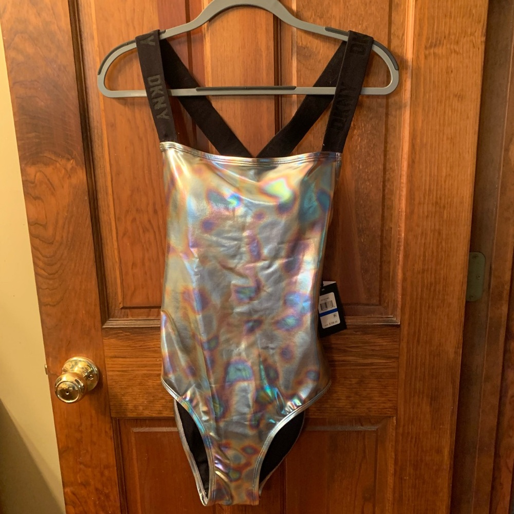 DKNY, NEW WITH TAGS, 1 piece bathing suit. Iridescent SILVER METALLIC finish.